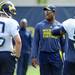 Former Michigan player Kevin Koger chats with defensive end Tom Strobel during warm ups on the practice field outside of the Al Glick Field House on Thursday, August 8, 2013. Melanie Maxwell | AnnArbor.com 